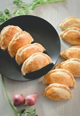  Empanadas Gallegas: Eine Symphonie aus knusprigem Teig und saftigen Füllungen!